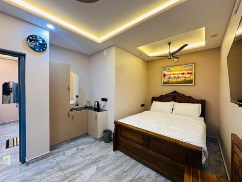 a bedroom with a bed and a bathroom at North paradise in Cochin