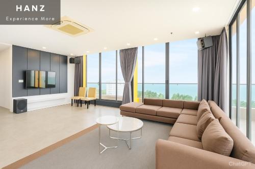 a living room with a couch and a table at S79 Happy 88 Tran Hung Dao Street in Phu Quoc