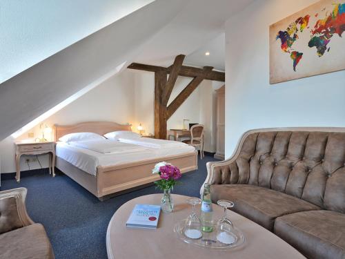 Ένα ή περισσότερα κρεβάτια σε δωμάτιο στο Hotel Stadt Hameln