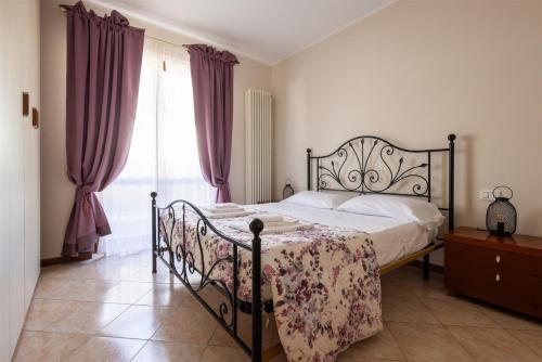 En eller flere senge i et værelse på IseoLakeRental - Sole