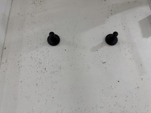 two black objects on top of a table at Gemütliches Kellerzimmer + Bad in Bocholt