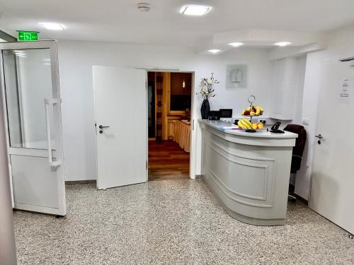 a kitchen with a island in the middle of a room at Hotel Lichtblick in Niederdorla