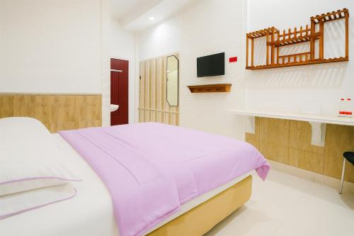 Novon Family Hotel by Tripletreeにあるベッド