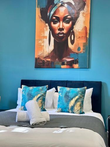 a painting of a black woman sitting on a bed at House in Tyneside Perfect for Travelers, Groups & Contractors Free Parking in Hebburn-on-Tyne