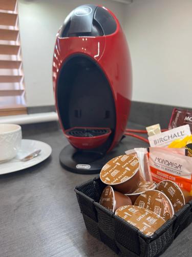 a red blender sitting next to a basket of chocolates at Covesea Horizon in Elgin