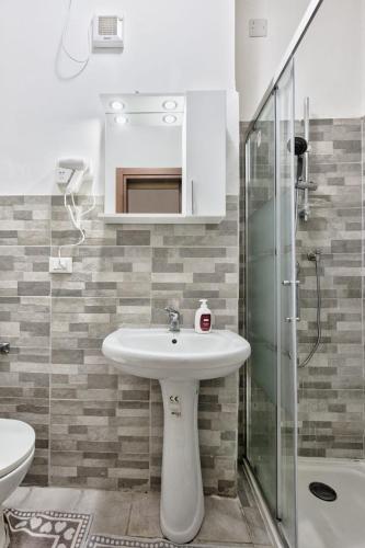 a bathroom with a sink and a glass shower at CaTeresa 14 in Venice