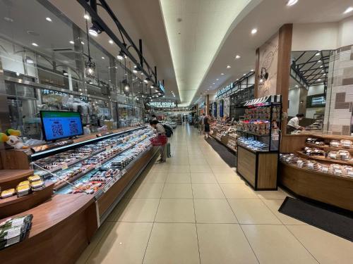 a grocery store aisle with a large amount of products at YMK Oshiage 5B in Tokyo
