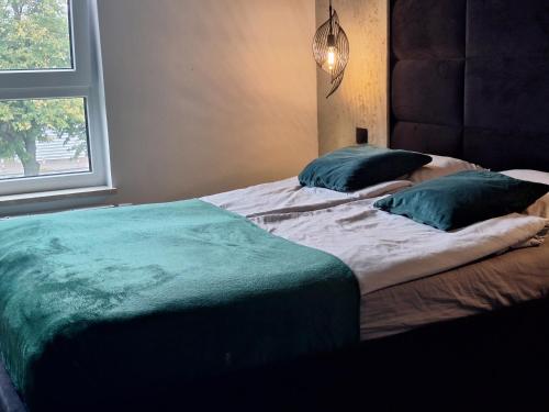 Ένα ή περισσότερα κρεβάτια σε δωμάτιο στο Apartament LOFT