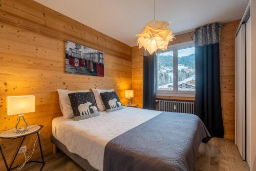 Ένα ή περισσότερα κρεβάτια σε δωμάτιο στο Ourson 3