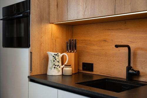 a kitchen with a sink and a vase on a counter at Haus Eder in Saalfelden am Steinernen Meer