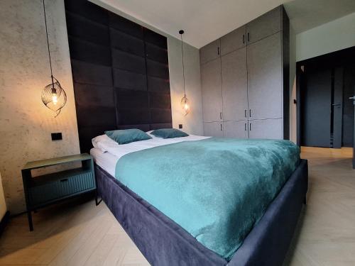 Ένα ή περισσότερα κρεβάτια σε δωμάτιο στο Apartament LOFT