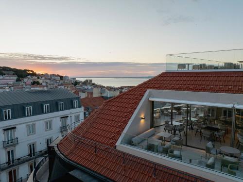 a view of a roof of a building with a patio at Lisbon Chiado Hotel & Spa in Lisbon