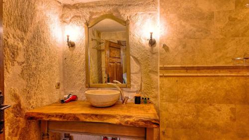 a bathroom with a sink and a mirror at Anjelic Cave Cappadocia in Urgup