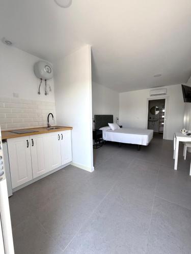 Ένα ή περισσότερα κρεβάτια σε δωμάτιο στο M&A Hostal