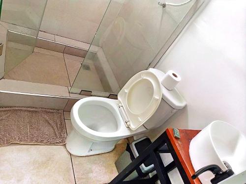 a bathroom with a toilet and a sink at Kalo Shipping Container in Christiansborg
