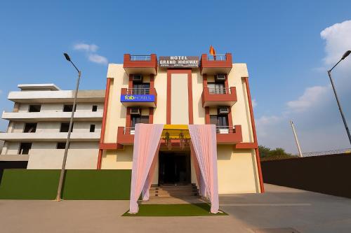 a building with a curtain in front of it at FabExpress Grand Highway in Faridabad