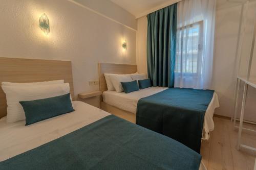 Katil atau katil-katil dalam bilik di Mia Hill Suites