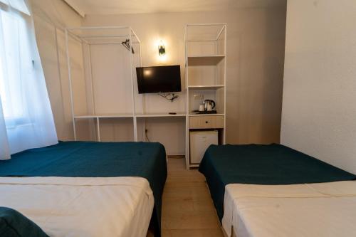 Katil atau katil-katil dalam bilik di Mia Hill Suites