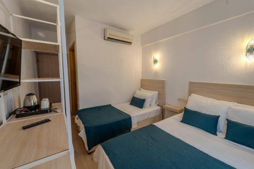 Katil atau katil-katil dalam bilik di Mia Hill Suites