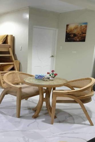 a table and two chairs in a room at Michael's Homestay - Farm Villa near Patar Beach & Bolinao Falls in Bolinao