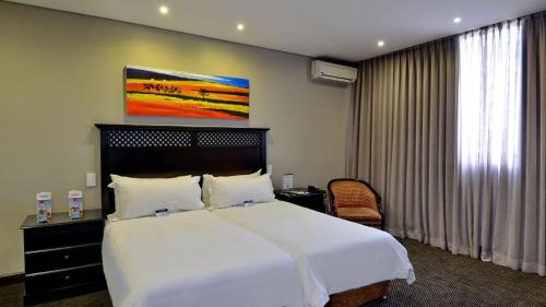 Katil atau katil-katil dalam bilik di ANEW Hotel Witbank Emalahleni