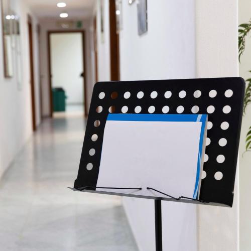 a black and white polka dot chair in a hallway at Hotel Eden in Cinquale