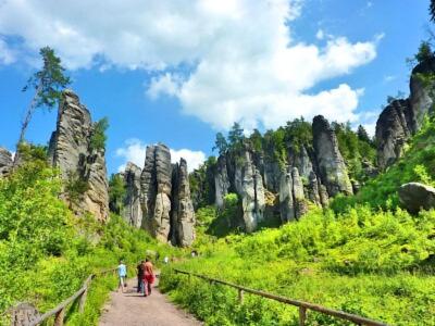 a group of people walking down a path in the mountains at Tiny-House in Paradise - Maringotka v Raji in Turnov