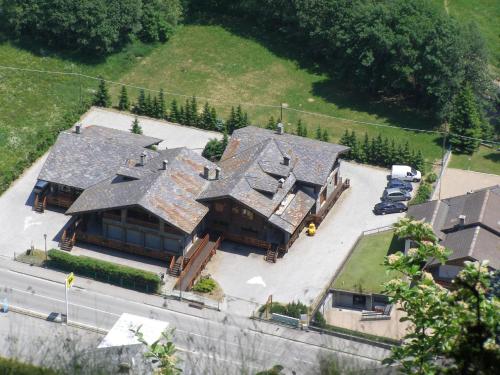 an aerial view of a large house with a yard at Apartment with Fireplace in Antey-Saint-André
