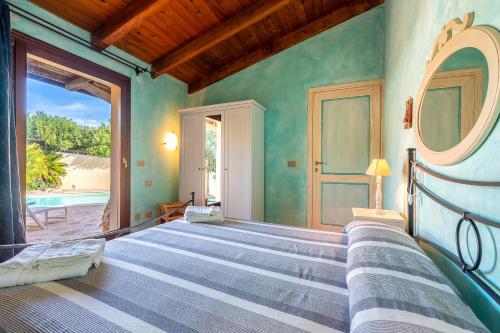 Ένα ή περισσότερα κρεβάτια σε δωμάτιο στο Villa Aurora Con Piscina Privata