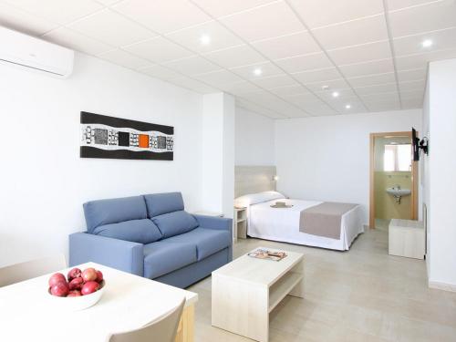 Postel nebo postele na pokoji v ubytování AReH Apartamentos