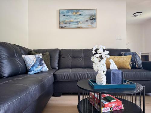 a living room with a couch and a table at Cypress Suites - Stylish apartments in Newburgh IN in Newburgh