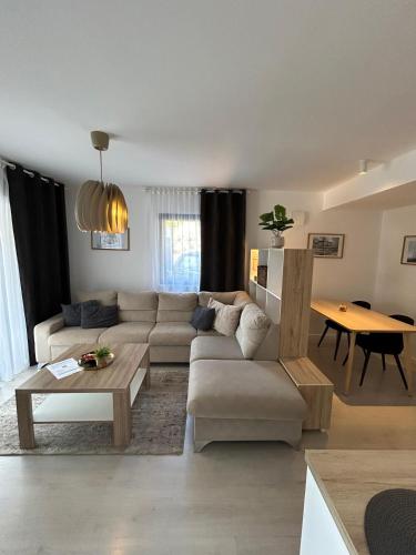 a living room with a couch and a table at Villa Laura in Gornji Vakuf