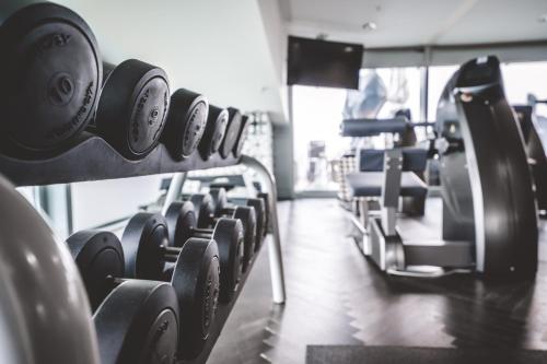 a row of dumbbells lined up in a gym at Kameha Grand Bonn in Bonn