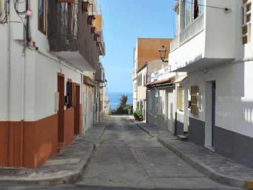 an empty alley way between buildings in a city at 12jazmines in Castillo de BaÃ±os