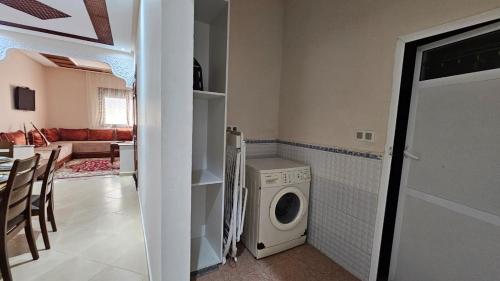 a laundry room with a washer and dryer in it at Dar Boujida in Larache