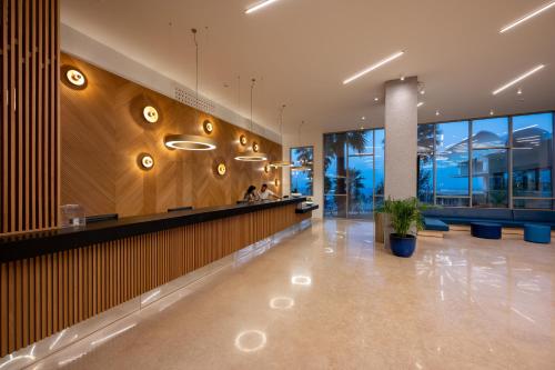 a lobby with a bar in a building at Royal & Imperial Belvedere Resort in Hersonissos