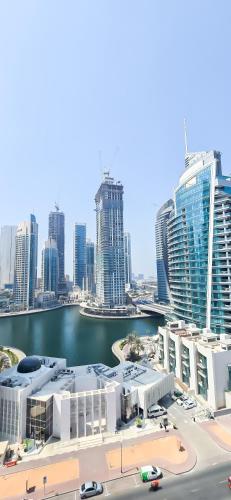 a view of a city with a body of water and buildings at Spacious Apartment Marina View in Dubai