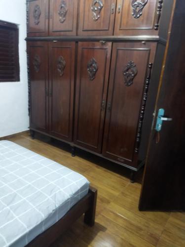 a row of wooden cabinets in a room at Cantinho da Flor in Barretos