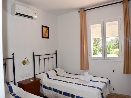 Katil atau katil-katil dalam bilik di Villa in Sant Josep near Cala Jondal Beach