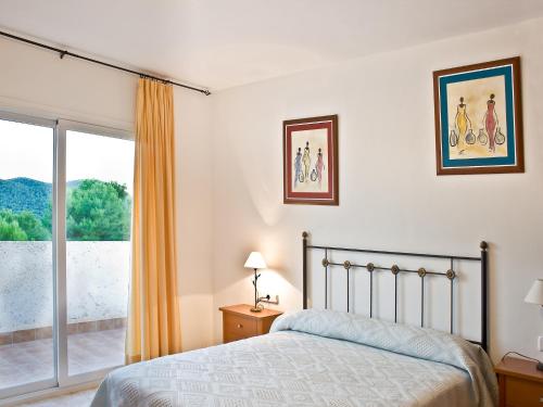 Katil atau katil-katil dalam bilik di Villa in Sant Josep near Cala Jondal Beach