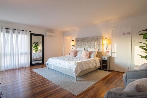 a large bedroom with a bed and a couch at Luxury Hilltop Retreat in the City - Amazing View in San Diego