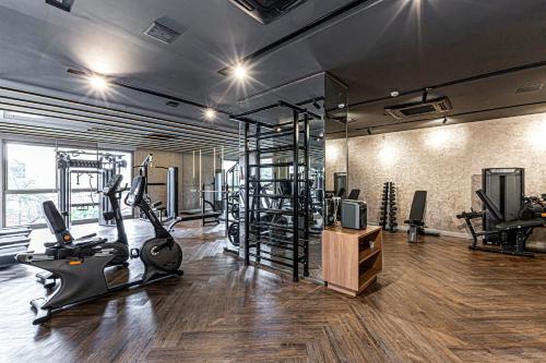 a gym with treadmills and exercise equipment in a room at Charlie Atmosfera Santo Amaro in Sao Paulo