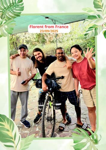 a group of people standing next to a bike at DRIMIN - by Sunrise Caravan boutique Guesthouse and hostel in Tashkent