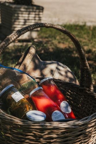 a basket filled with bottles of drinks in it at Santa Maria Apartments in Forino