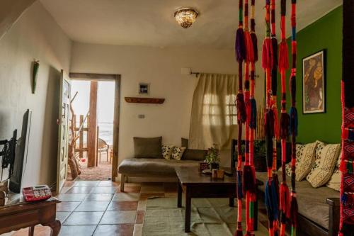 a living room with a couch and a table at Asia's House in Dahab