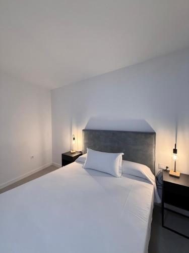 Ένα ή περισσότερα κρεβάτια σε δωμάτιο στο M&A Hostal