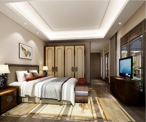 a bedroom with a large bed and a flat screen tv at Hotel Grand Villa Palce Near New Delhi IGI Airport in New Delhi