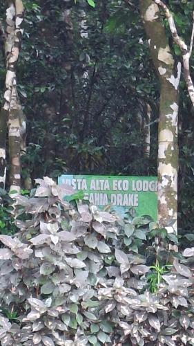 a sign in the middle of a bunch of trees at Vista Alta Ecolodge Bahia Drake in Drake