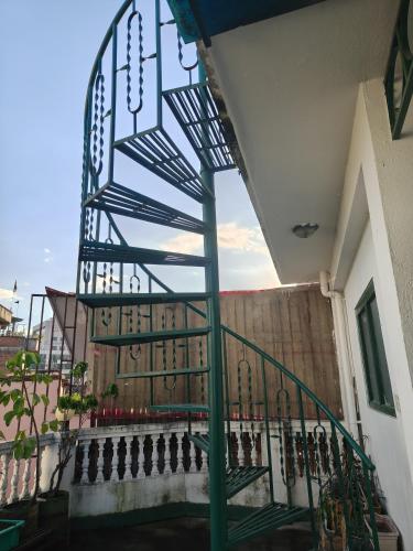 a spiral staircase on the side of a building at Casablanca Nepal at Tours By Nayan in Kathmandu
