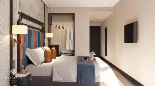 a hotel room with a bed and a table at Mandala Cham Bay Mui Ne in Ấp Nhơn Hòa
